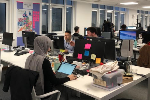 Some DfE digital team members work at desks