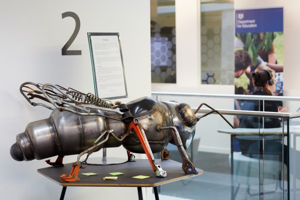 A photo of a big metal bee structure in our Manchester office.