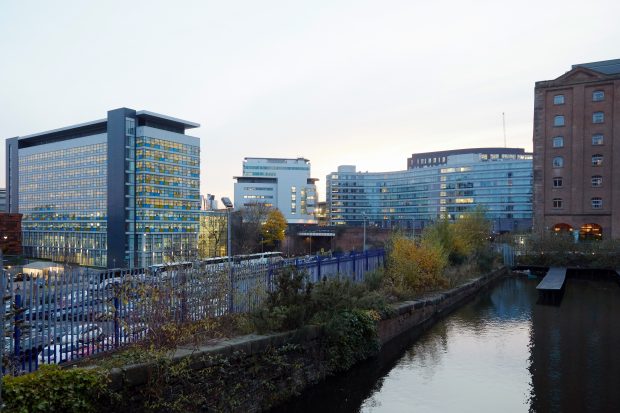 A photograph of our Manchester office at dusk, overlooking the river. 