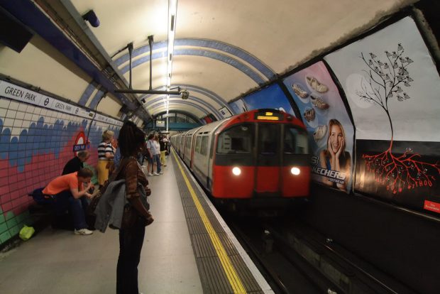 Photo of woman standing on Green Park tube station platform